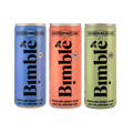 Three cans of Bimble sparkling honey drinks in blue, orange, and green on a white background.
