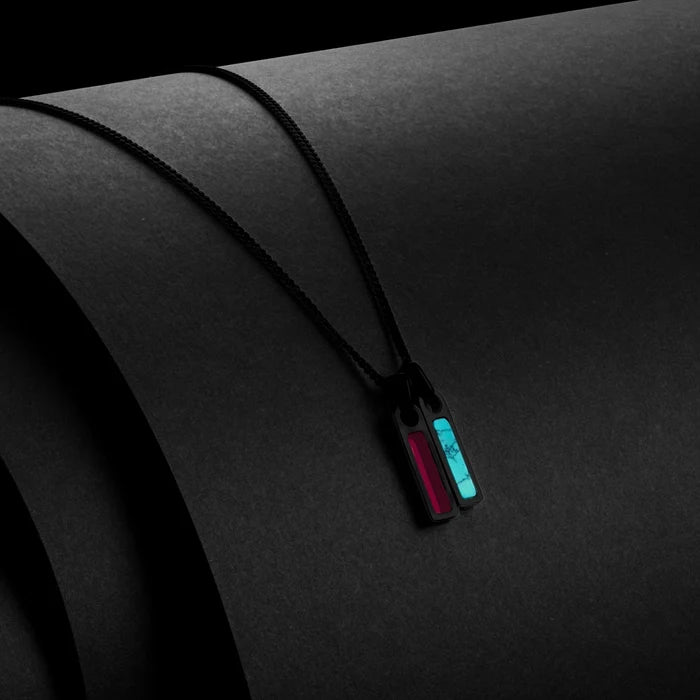 Black lanyard with red and blue tags on a dark background