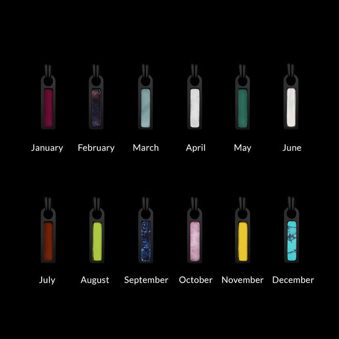 Pendants for each month of the year on a black background