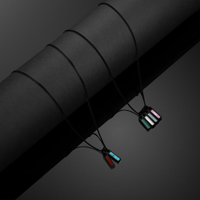 Necklace with colorful pendants on a dark background