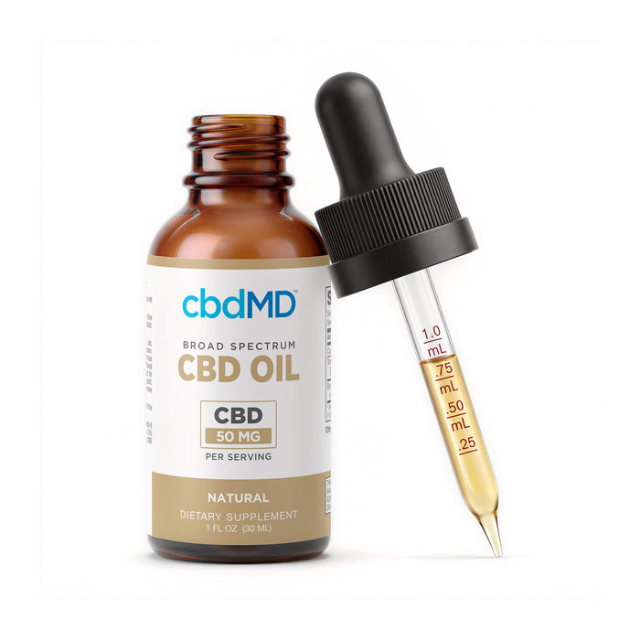 An amber glass dropper bottle of cbdMD Broad Spectrum CBD Oil 50 mg next to a glass dropper containing the golden oil, on a white background.; Flavor: Natural; Strength: 1500MG;