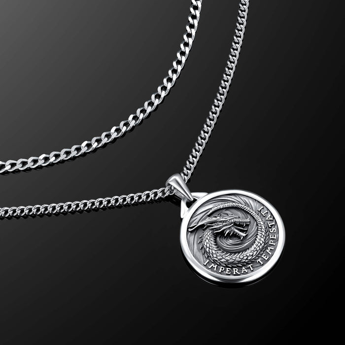 Silver necklace with a round pendant on a black background