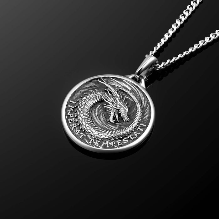 Silver dragon pendant necklace on a black background