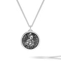 Silver necklace with a round pendant on a white background