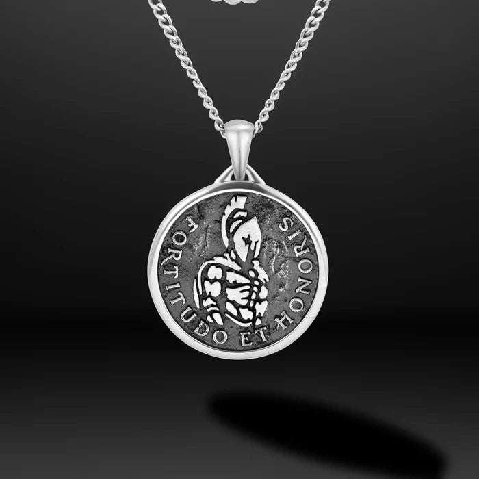 Close-up of a silver chain necklace with silver Spartan pendant