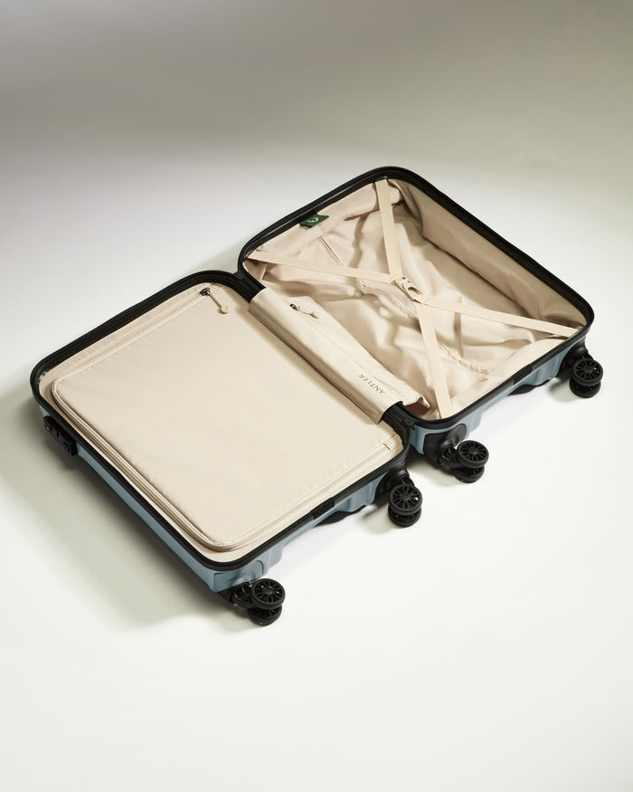 a suitcase with wheels and a lid