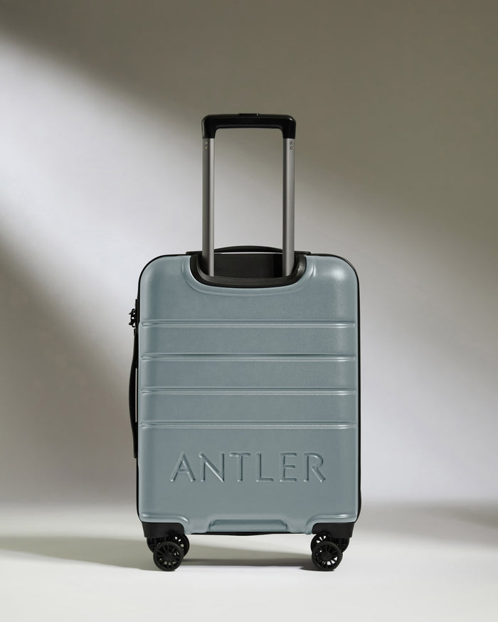 a grey suitcase with handle