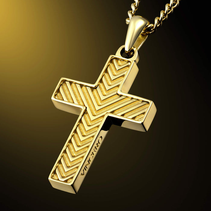 A gold cross pendant necklace with a textured chevron pattern, hanging from a gold chain against a dark gradient background.