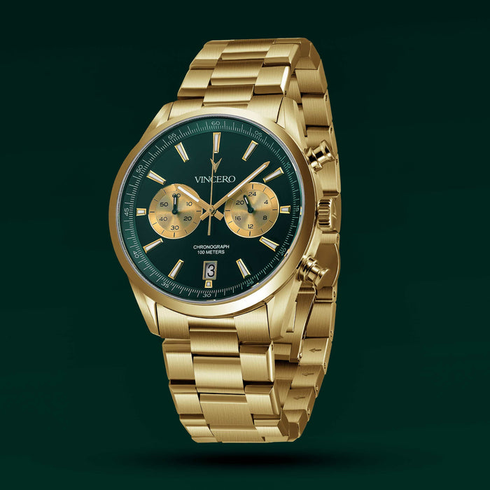Gold wristwatch with a dark face on a green background