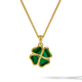 A gold chain necklace with a four-leaf clover pendant featuring green malachite inlay, shown on a clean white background.