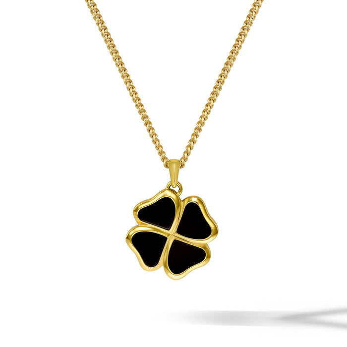 Gold necklace with a black four-leaf clover pendant on a white background