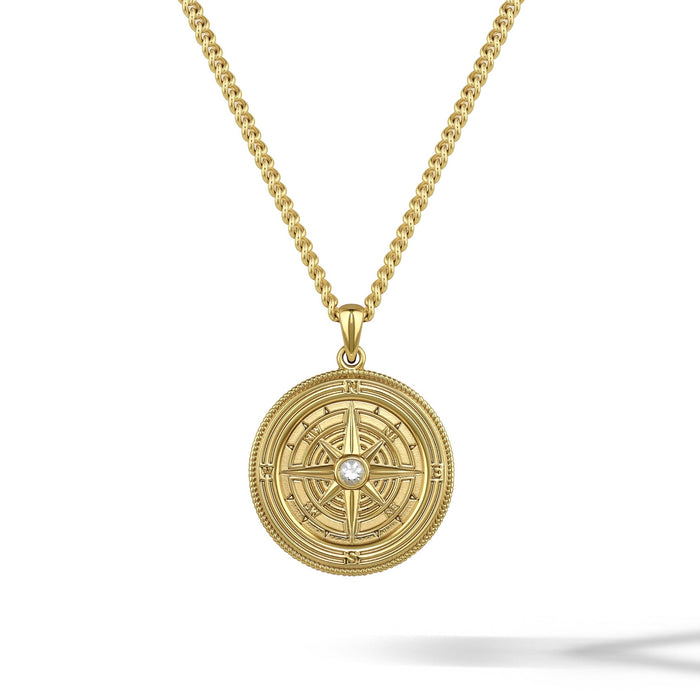 Gold necklace with a circular pendant on a white background