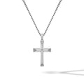 Silver cross pendant on a chain against a white background