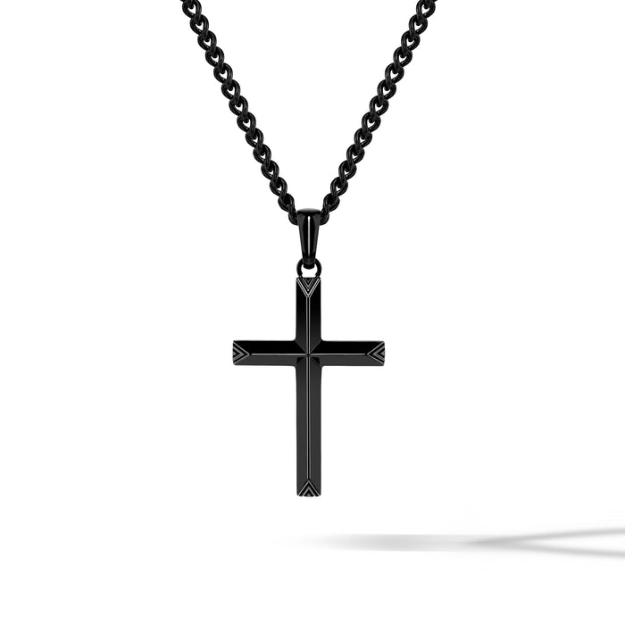 Black cross pendant on a chain against a white background