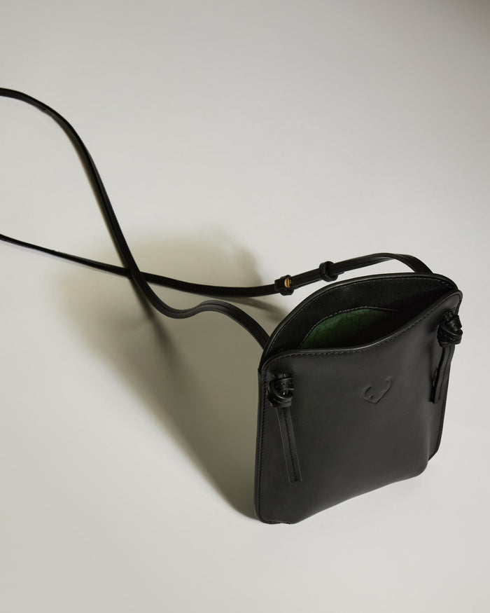a black purse with a strap