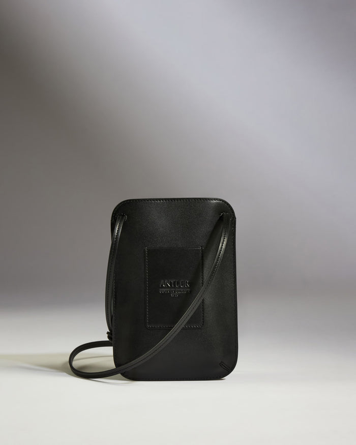 a black purse with a strap