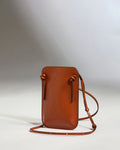 a brown purse with a strap