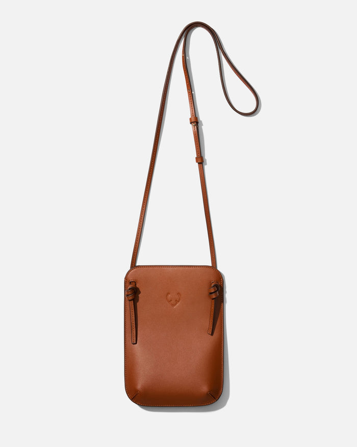 a brown leather bag with a strap
