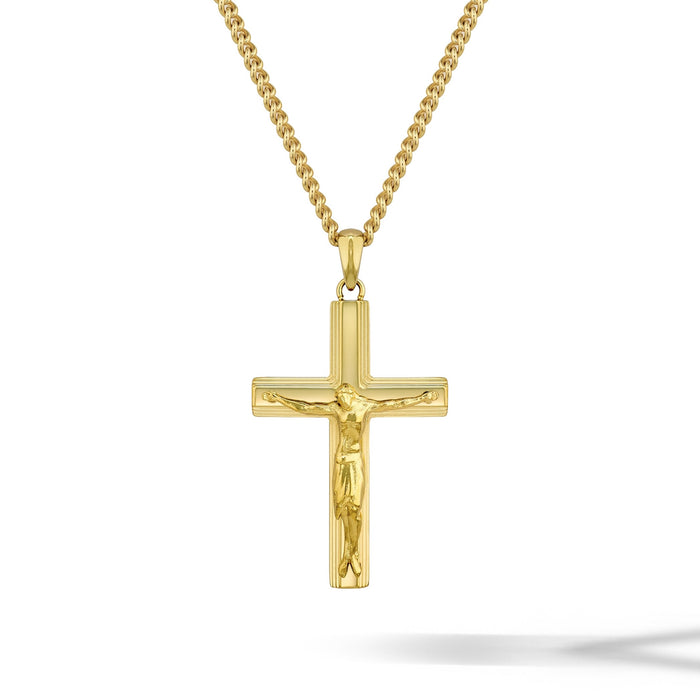 Gold crucifix pendant necklace on a white background