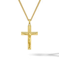 Gold crucifix pendant necklace on a white background
