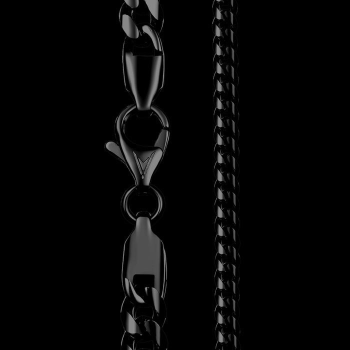 Close-up of a black chain with a clasp on a black background