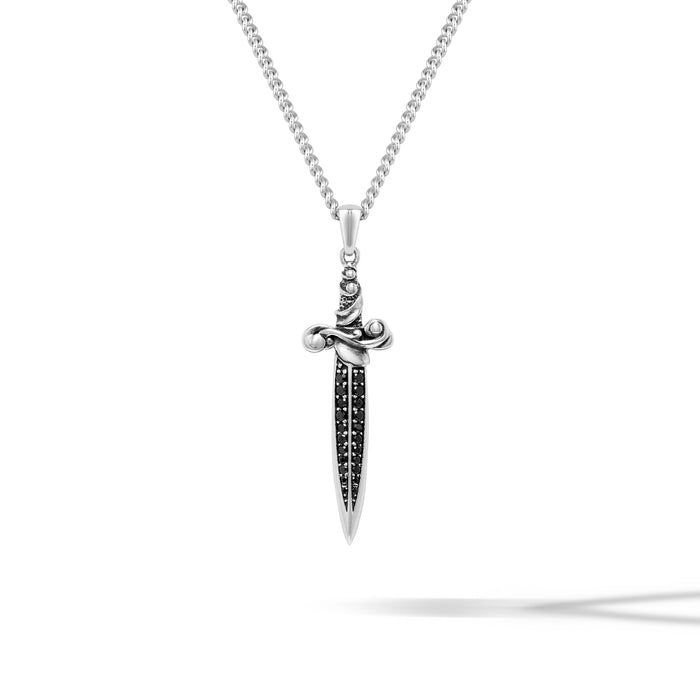Silver dagger-shaped pendant with black stones on a white background