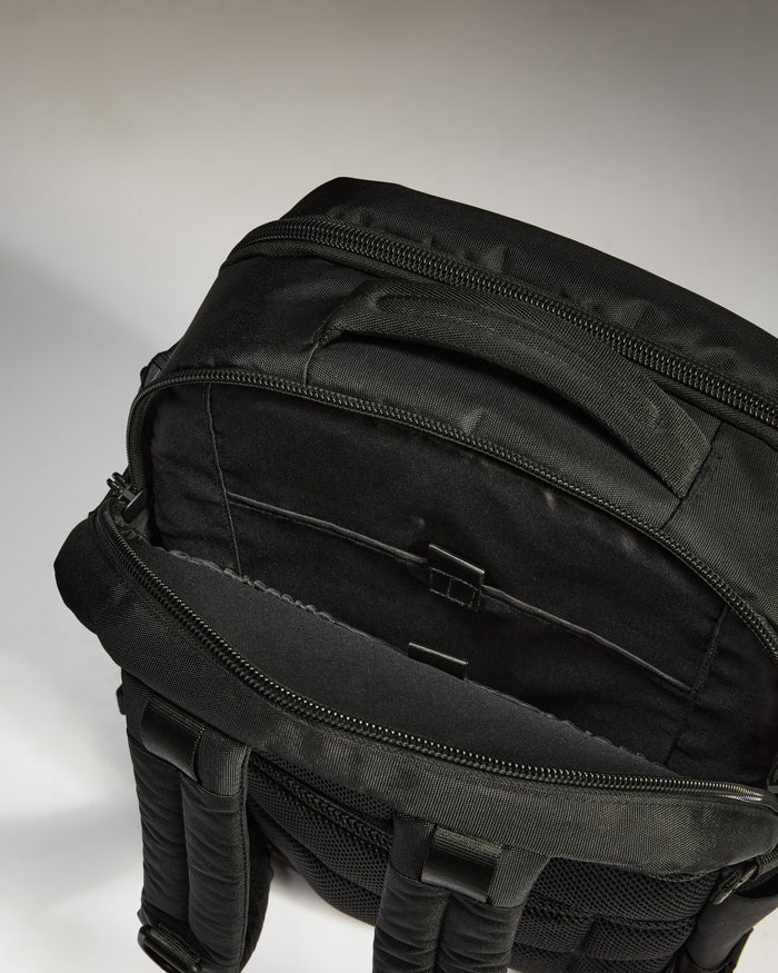 a black backpack with zippers