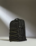 a black backpack with a light shining on it