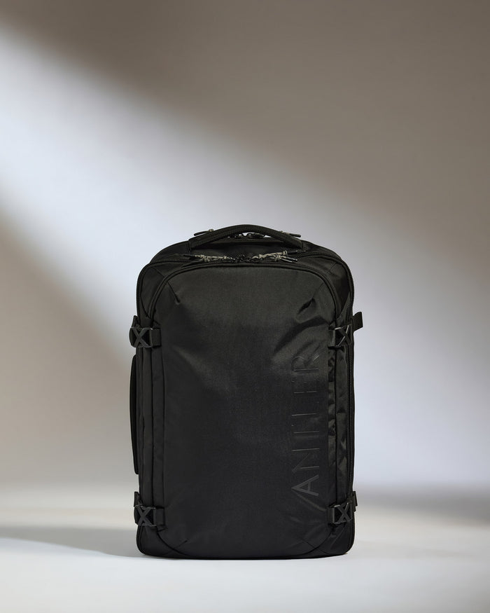 a black bag on a white surface