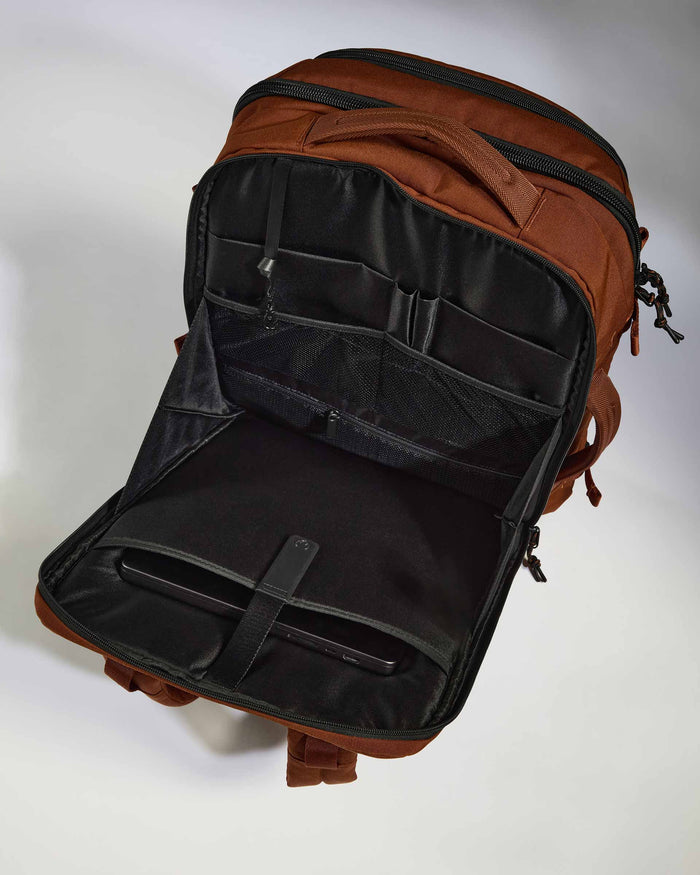 a brown backpack with a black strap