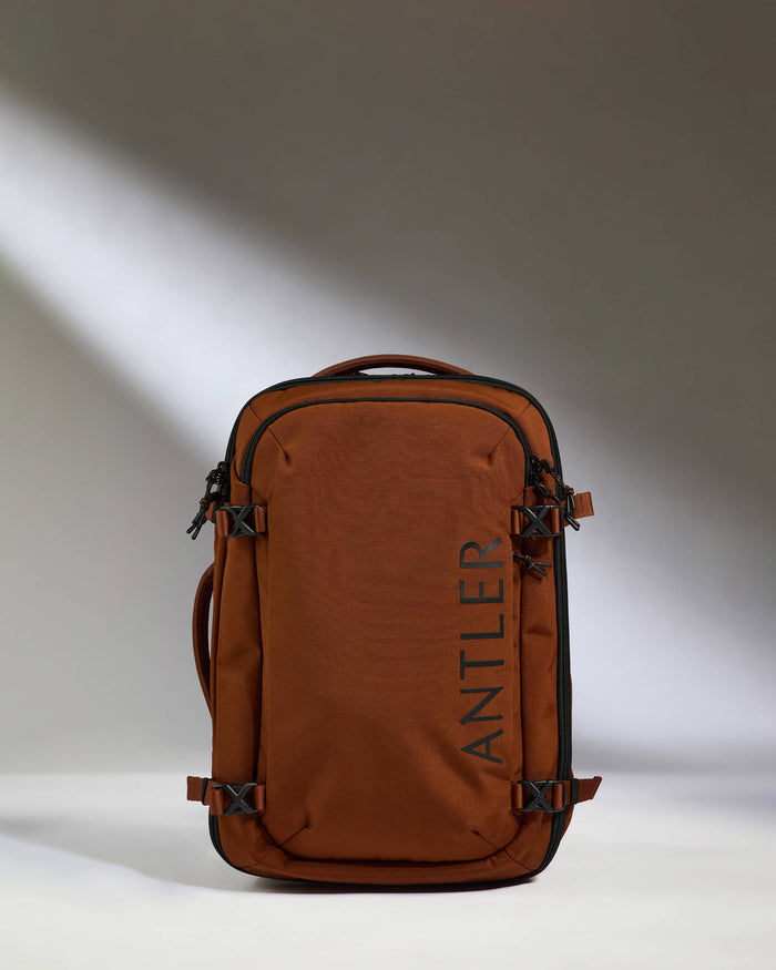 a brown bag with a black strap