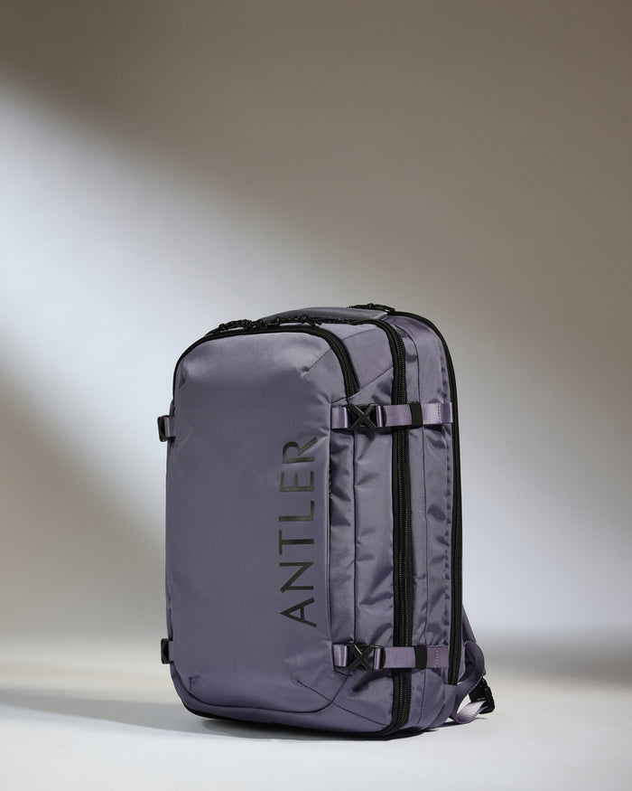 a grey backpack with black straps