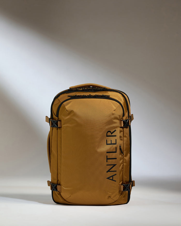 a brown backpack with black text