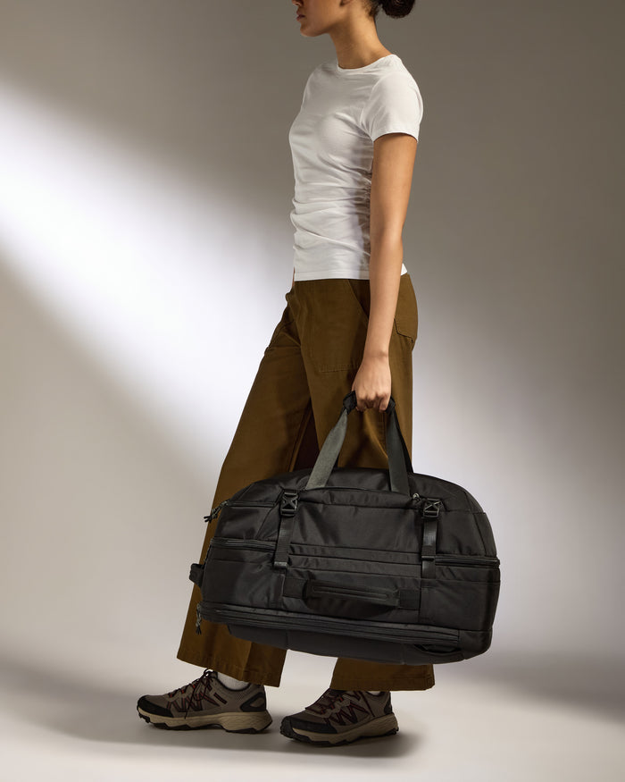 a woman holding a bag