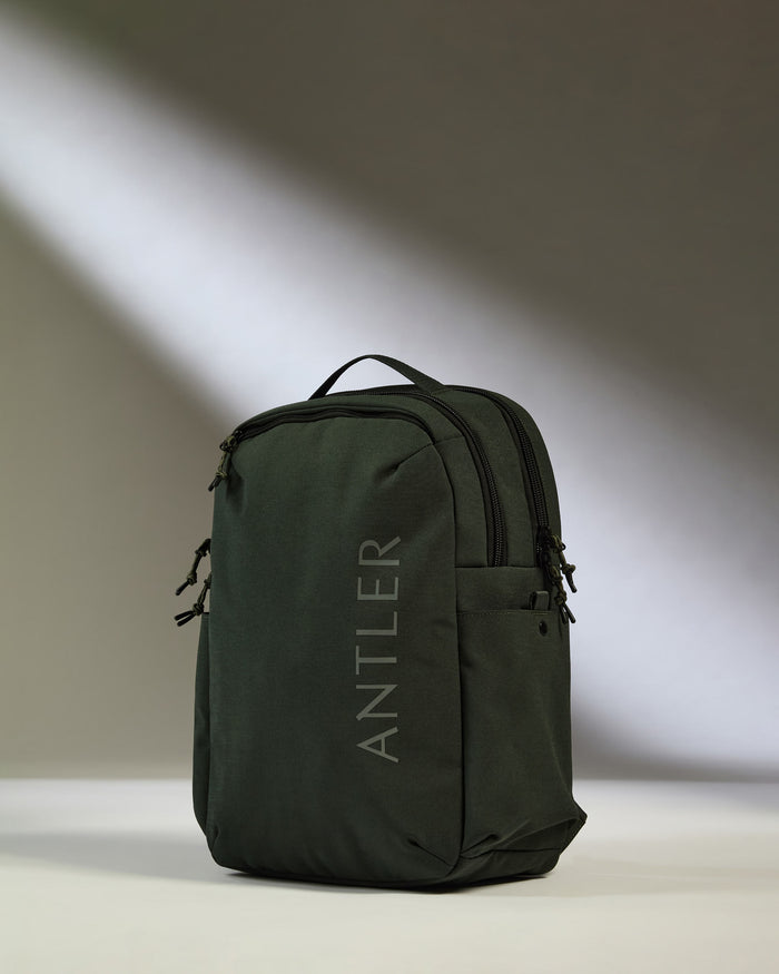 a black backpack with a white background