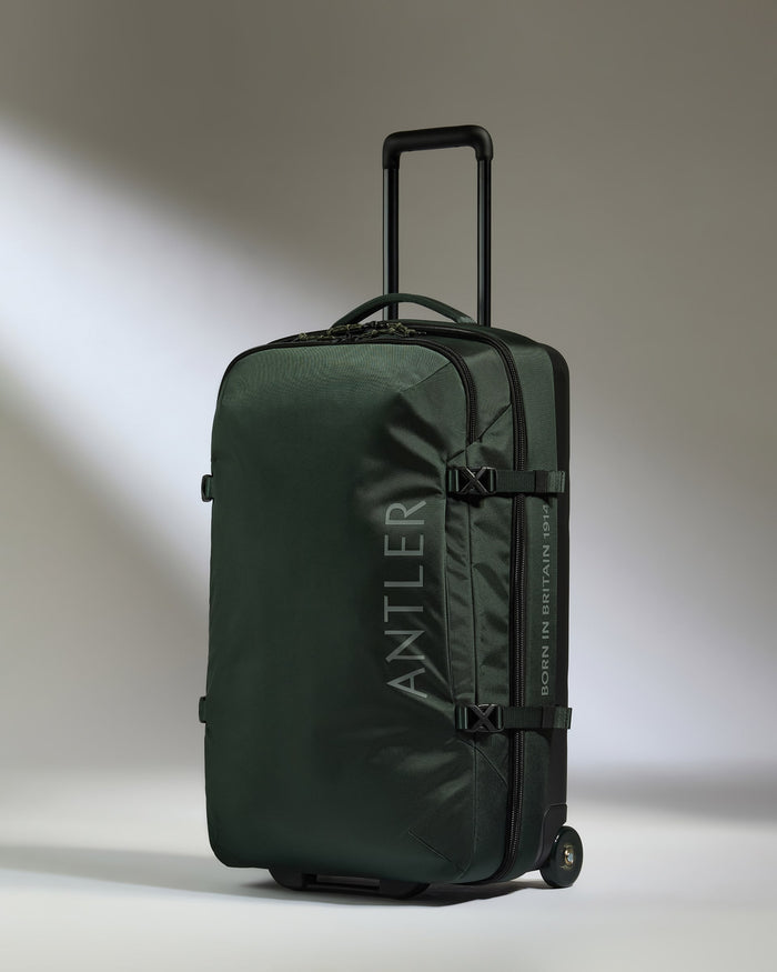 a green suitcase with wheels