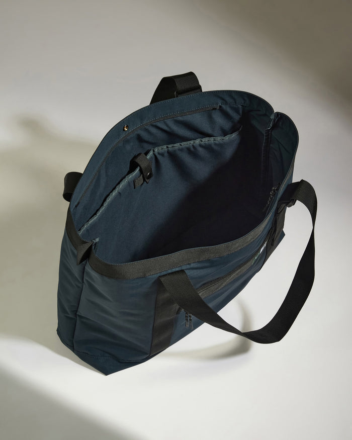 a blue bag with black straps