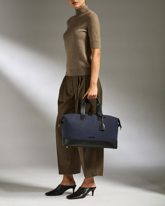 a woman holding a bag
