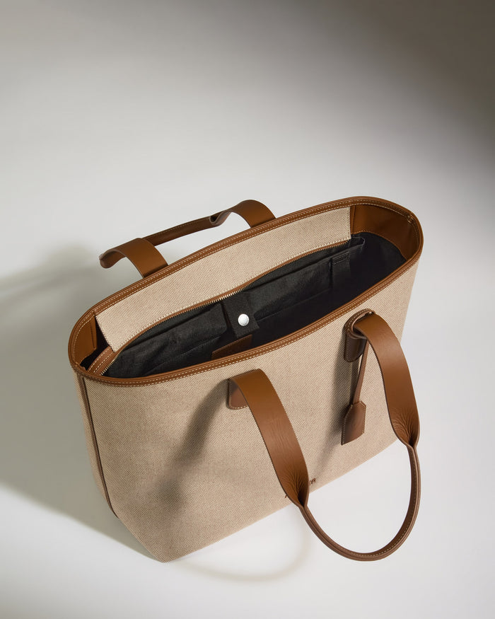 a brown and tan bag with a handle