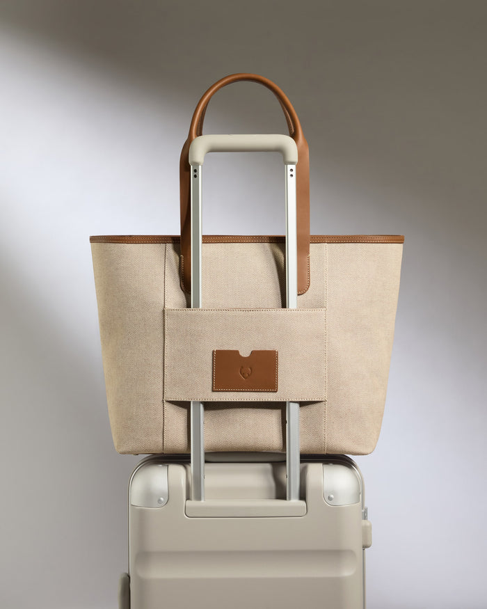 a bag on top of a suitcase