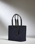 a blue bag with black handles