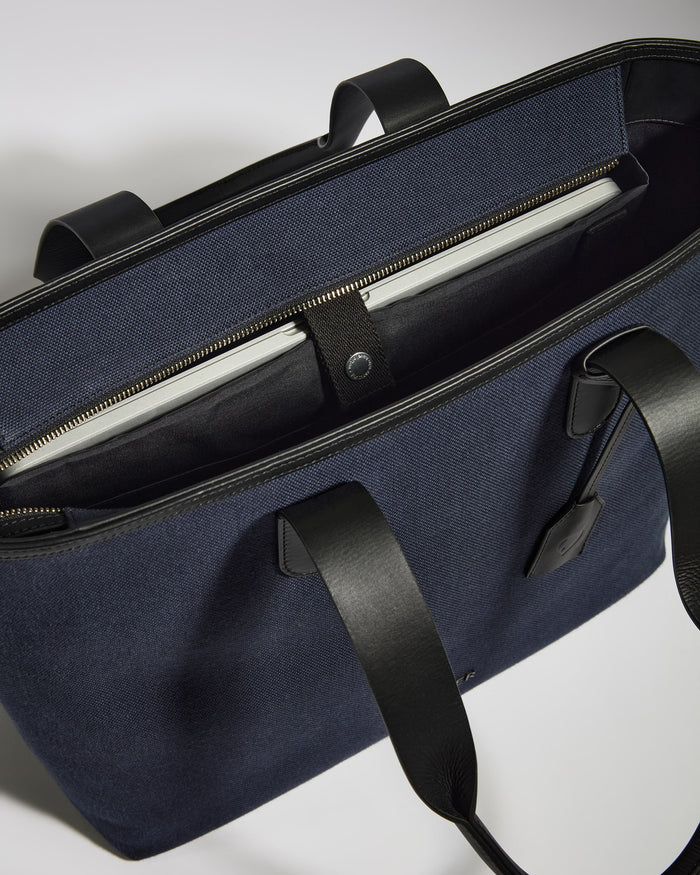 a blue bag with black straps
