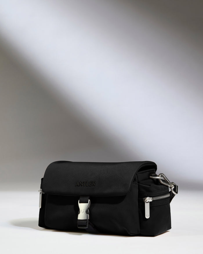 a black bag on a white surface