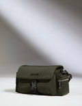 a green bag on a white surface