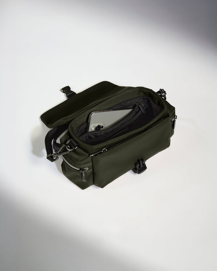 a green bag with a phone inside
