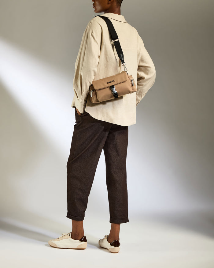 a woman with a purse on her back