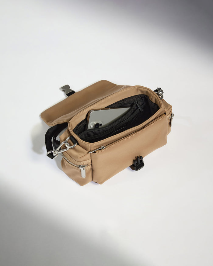 a tan bag with a phone inside
