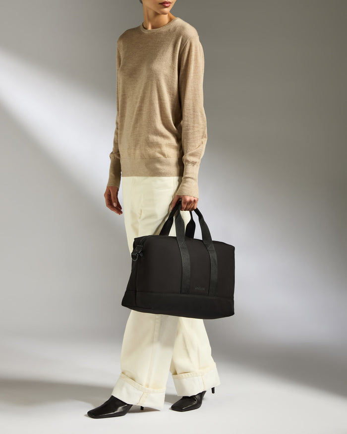 a woman holding a bag