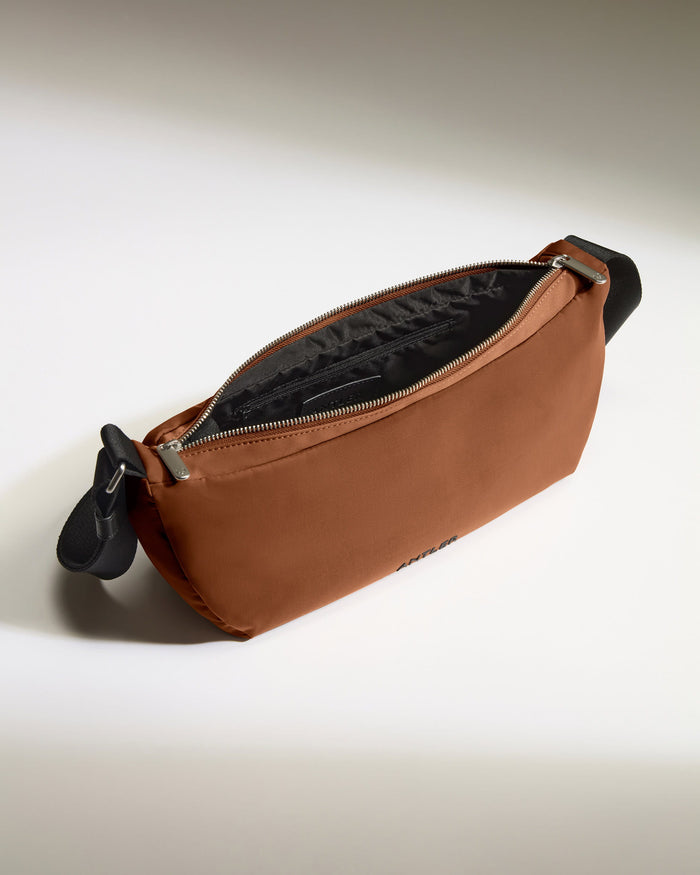 a brown bag with a black handle