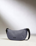 a grey bag with black straps